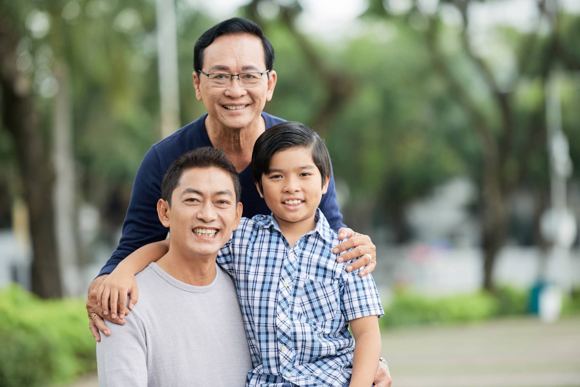 Elderly Asian man with son and grandson